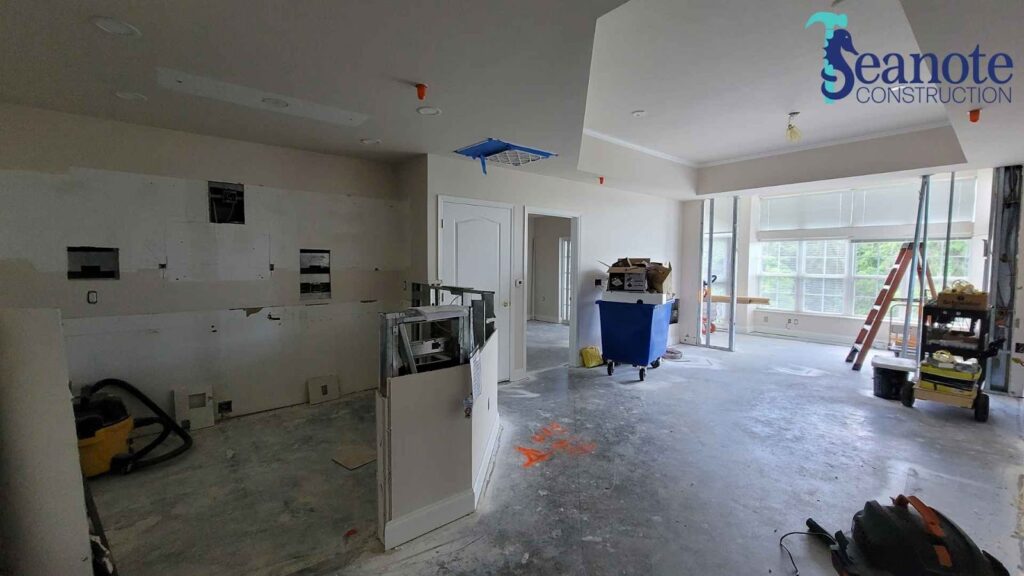 Home renovation in progress with construction materials inside.