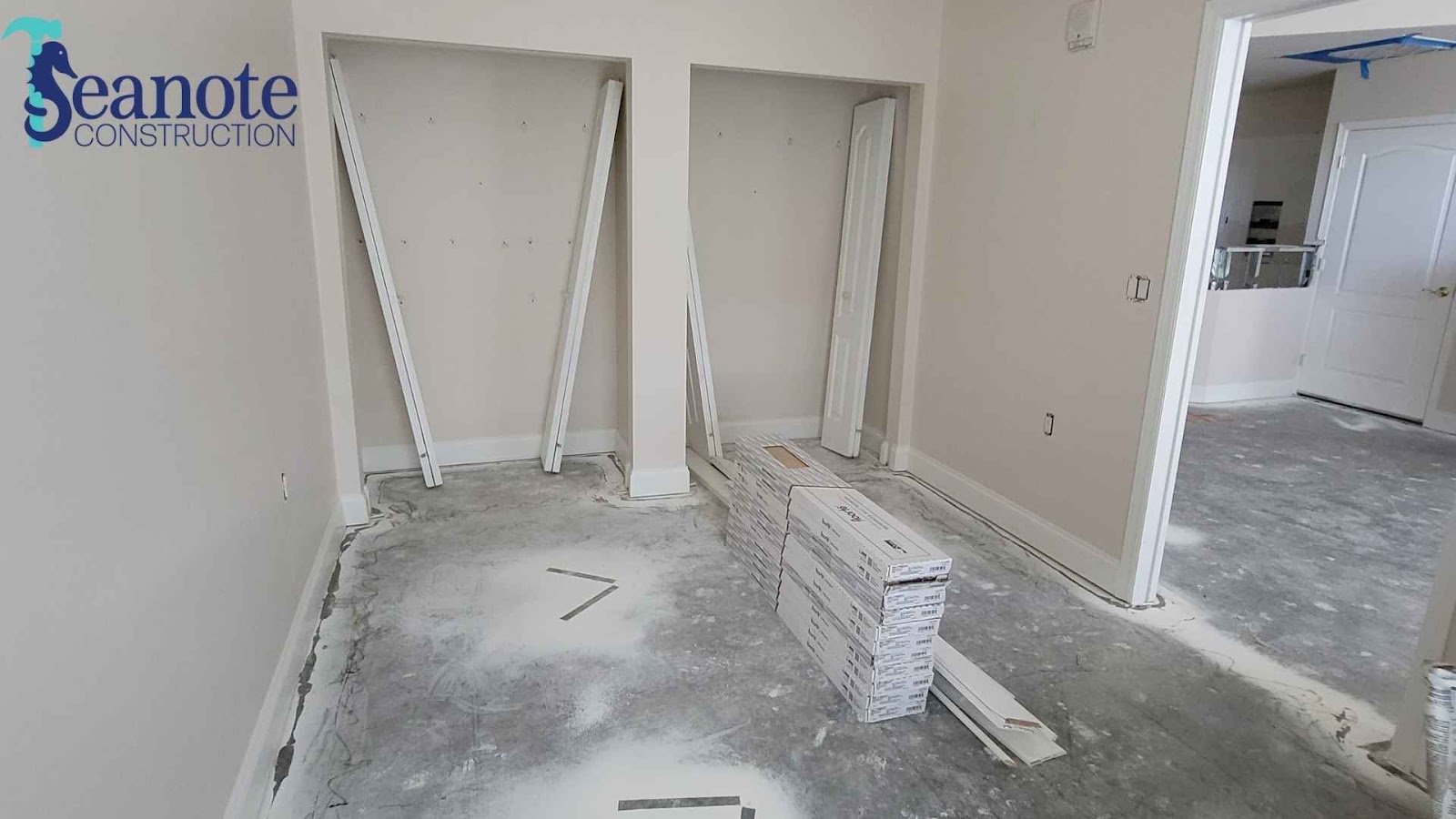Room under construction with flooring materials.