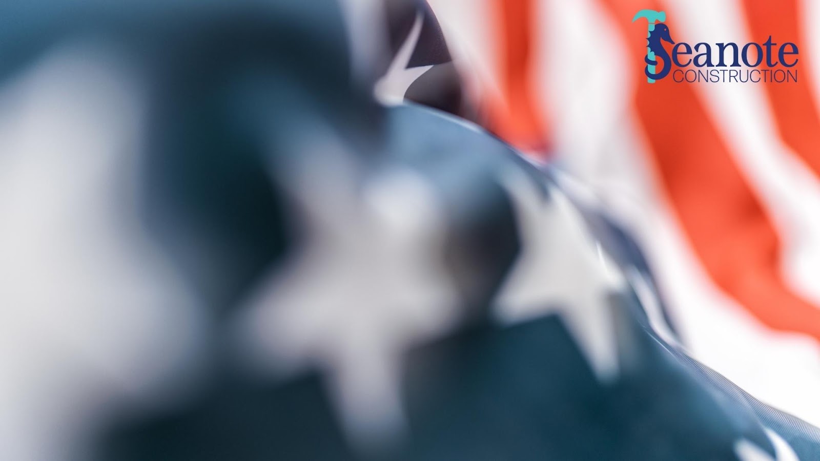Blurred American flag with company logo