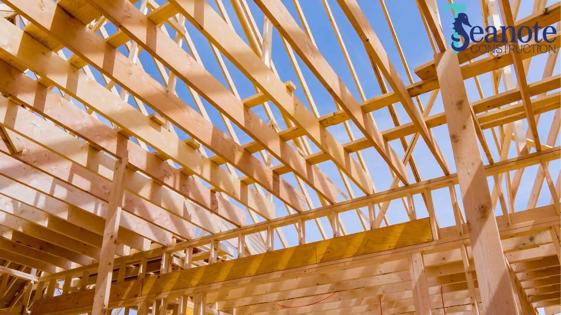 Wooden roof trusses under construction.
