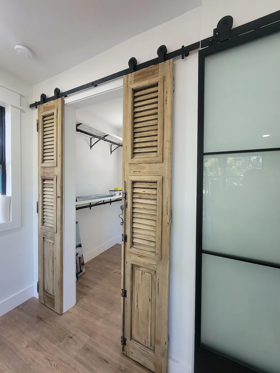 Rustic sliding barn door in modern room